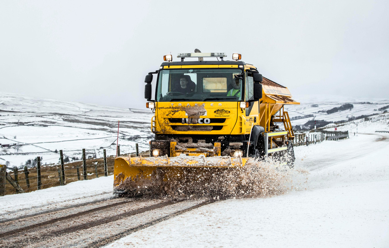 image of a gritter clearing snow from a road