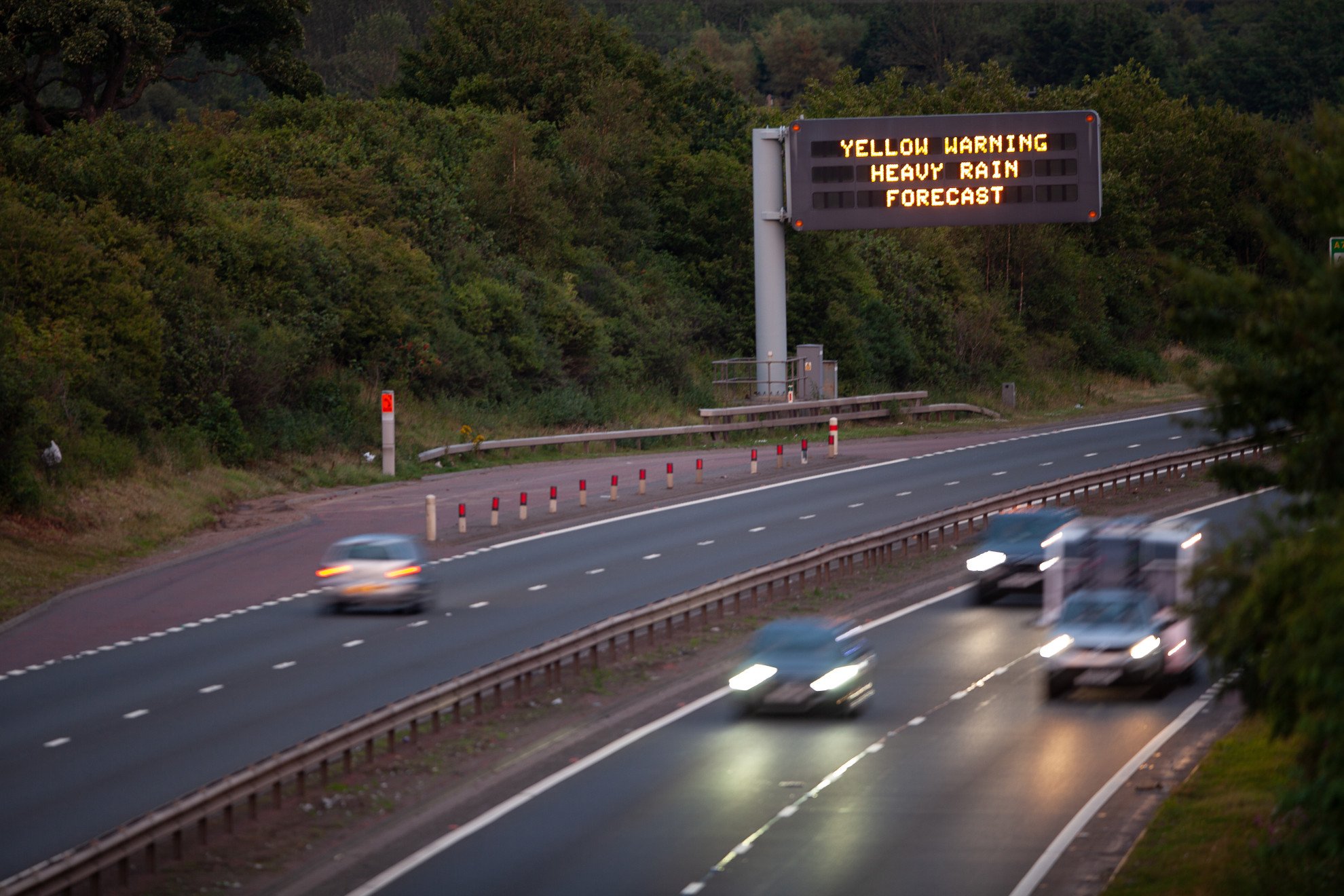 image of a variable message sign displaying a yellow weather warning