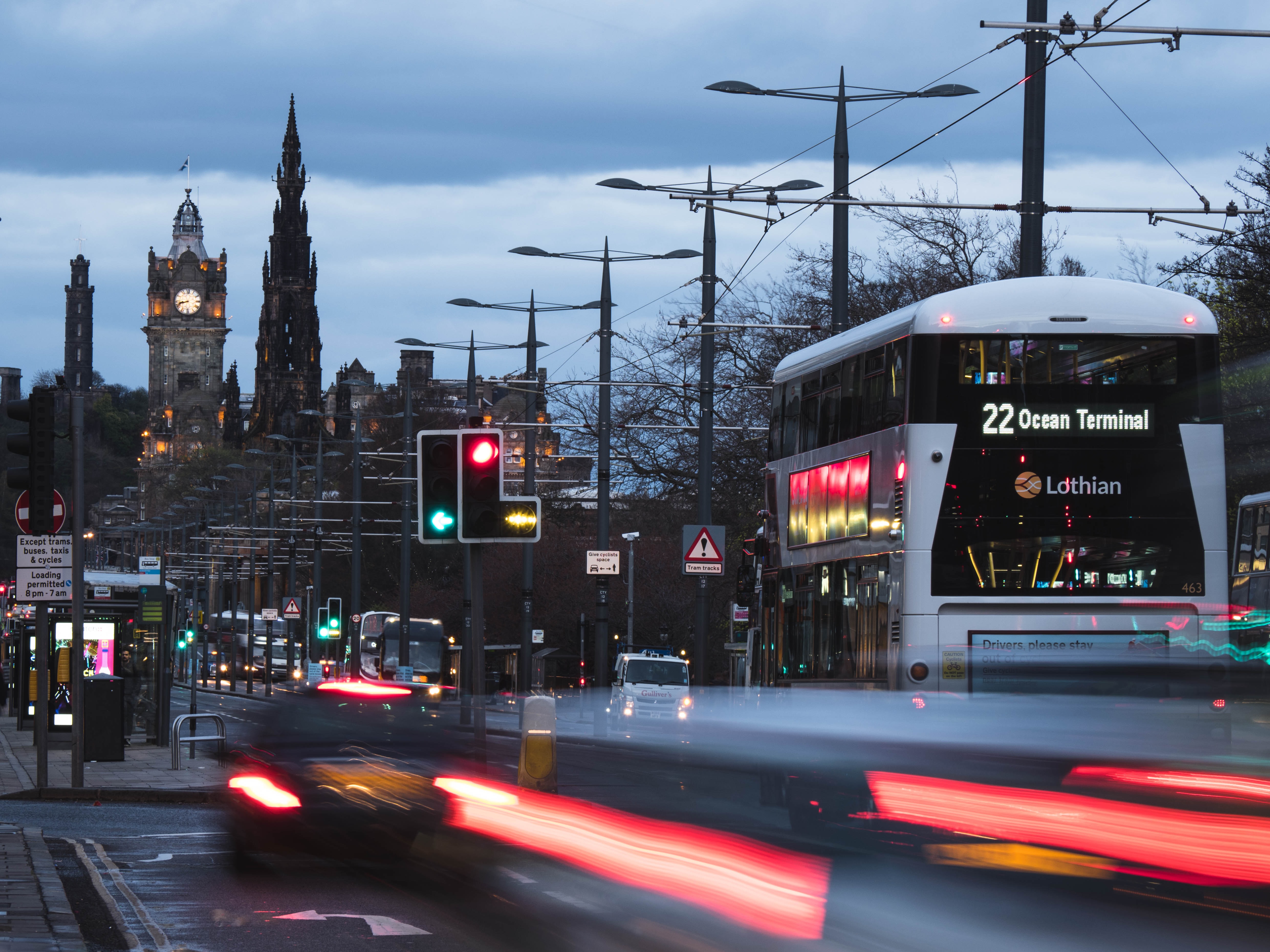 A busy city road with buses, cars and taxis