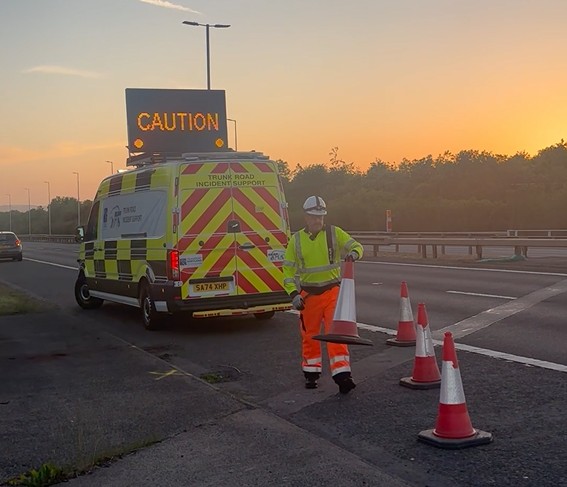 TRISS van with TRISS worker laying out cones